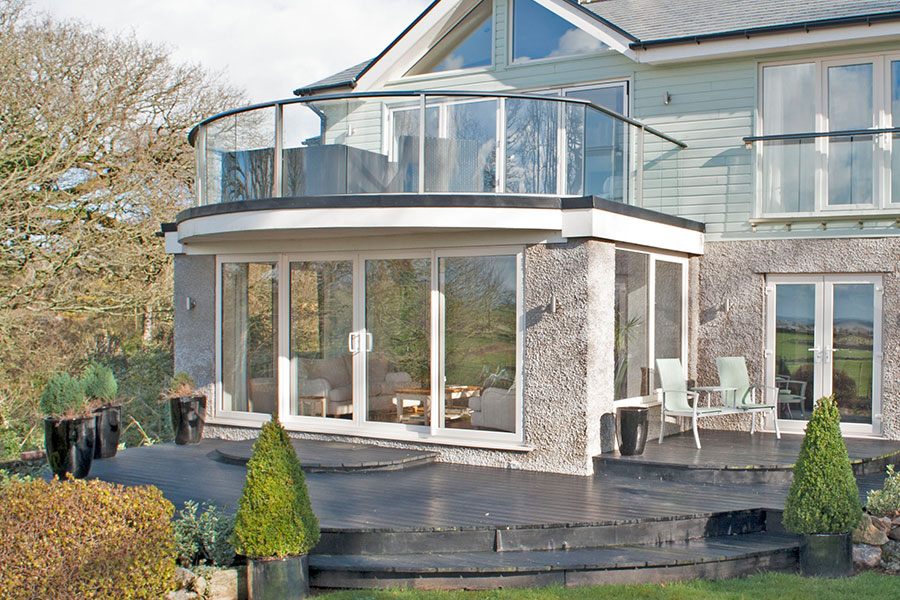 Home extension with bifold doors and glass balustrades