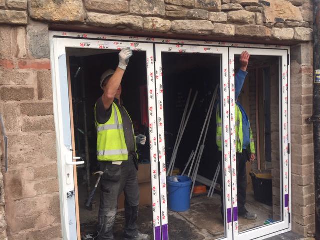 GHW team installing bifold doors for Nigthsafe