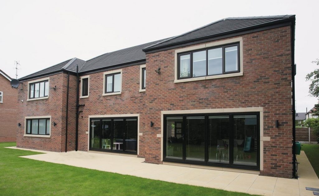 exterior shot of home with brown aluminium bifold doors