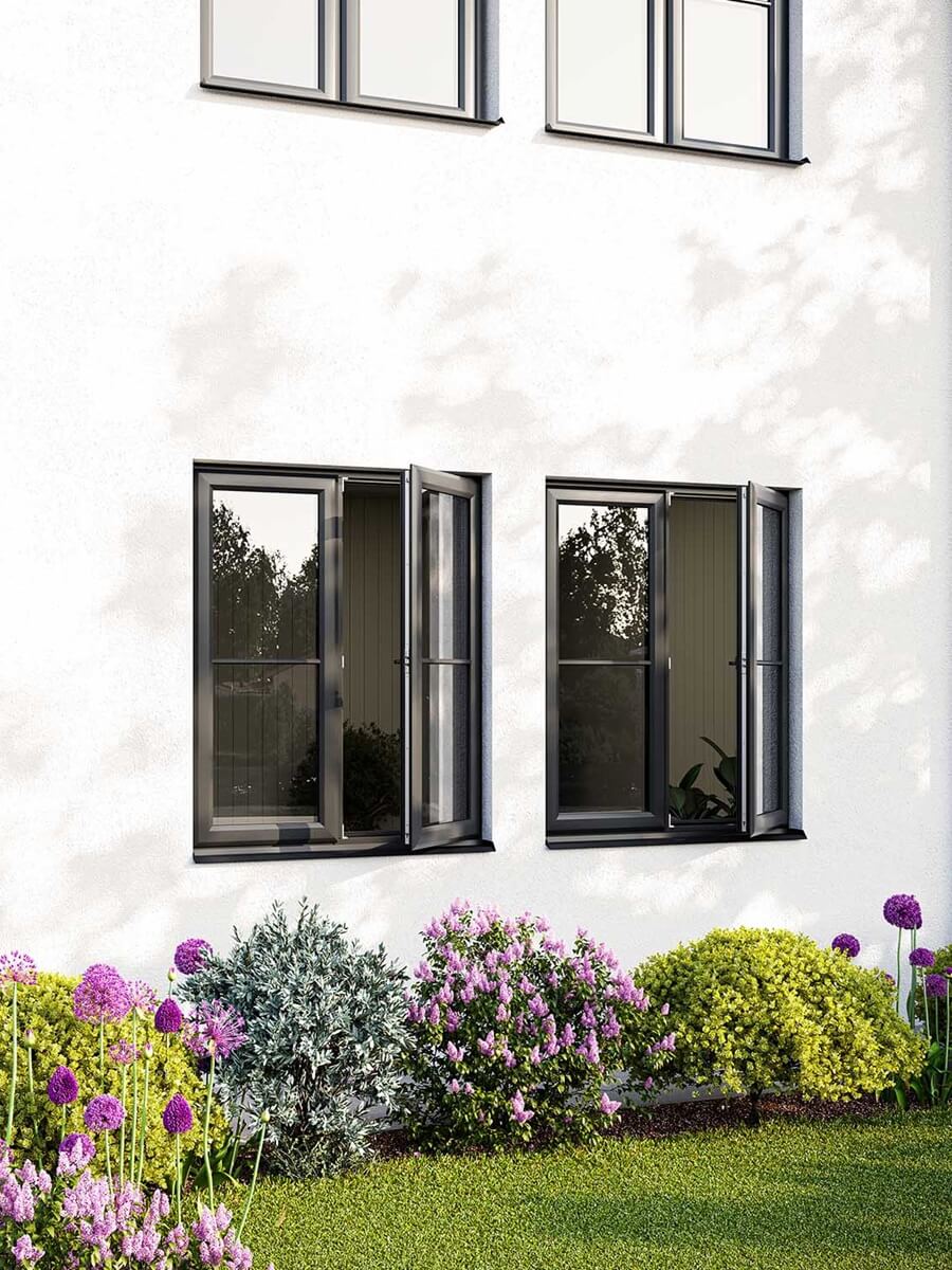 Elegant grey casement windows opening towards a vibrant garden, enhancing home aesthetics.