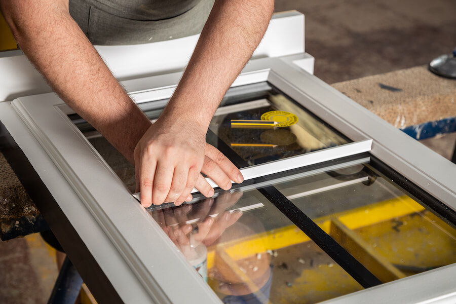 Craftsperson assembling timber sash bars into Accoya timber windows at Great Harwood Windows