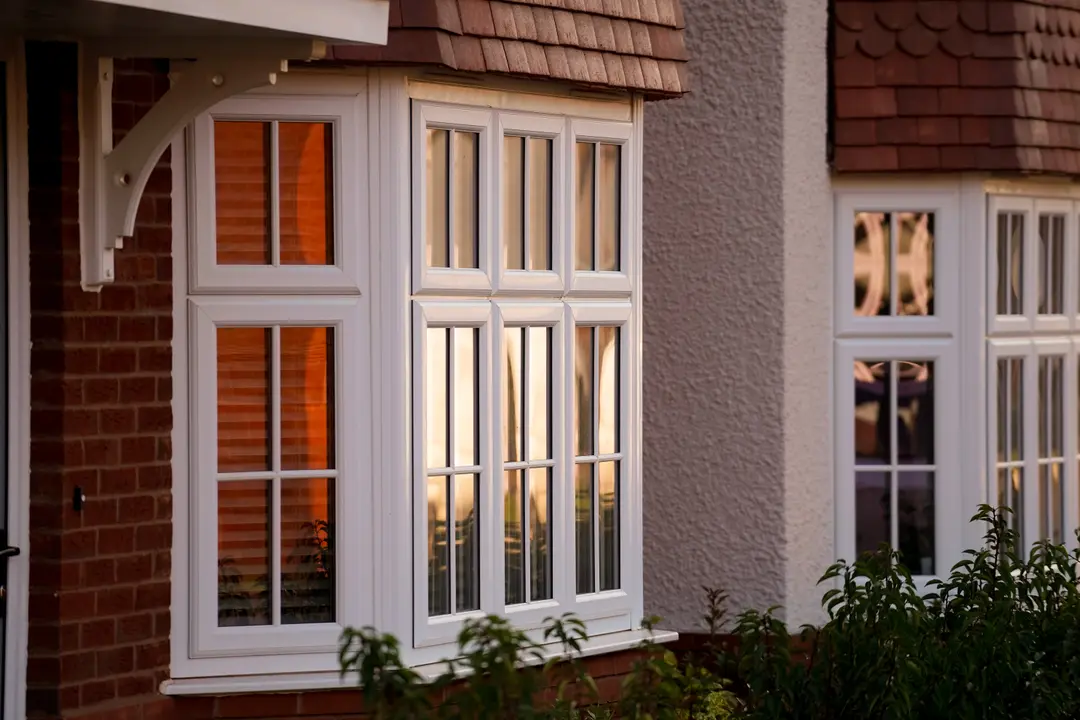 White uPVC bay windows with Georgian bars fitted to a traditional Blackburn home