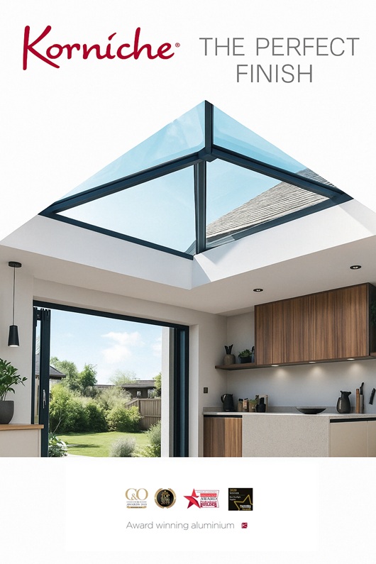 Korniche roof lantern in a contemporary kitchen extension with large glazed opening and garden views.