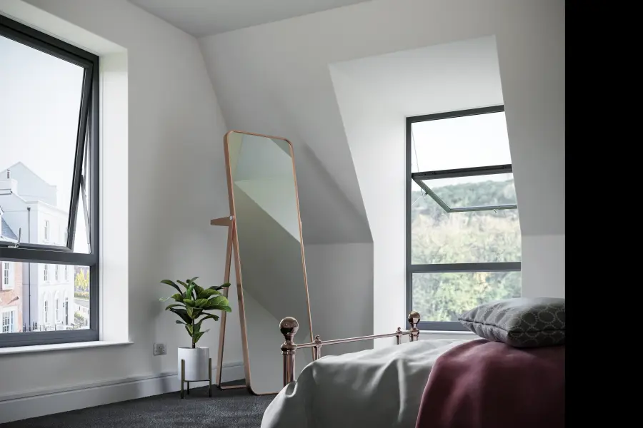 Reversible uPVC windows installed in a modern bedroom in Blackburn