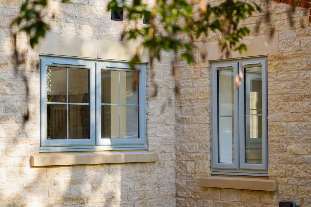 uPVC casement windows with astragal bars on a stone property in Blackburn
